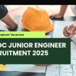 Focused professionals, meticulously examining blueprints for the MPIDC Junior Engineer Recruitment 2025.